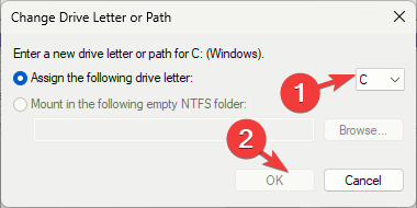 Selectați noua literă de unitate din meniul derulant; lângă opțiunea Atribuiți următoarea literă de driver, faceți clic pe OK.